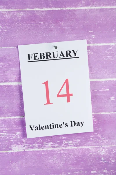 Valentines Day, February 14 on calendar on wooden background — Stock Photo, Image