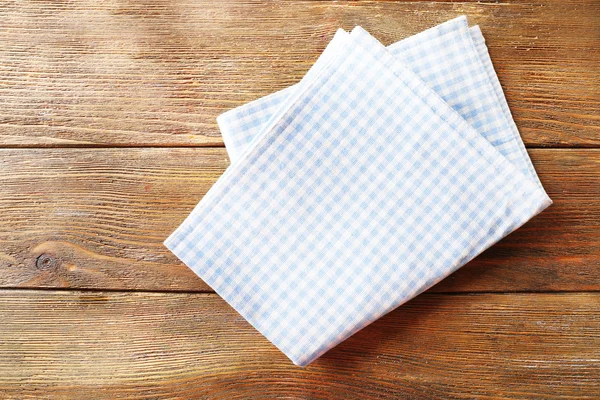 Napkin on wooden table — Stock Photo, Image