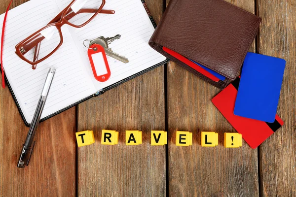 Set of tourist with word Travel on wooden planks background — Stock Photo, Image