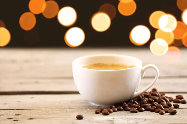 Cup of coffee on table on brown background — Stock Photo, Image