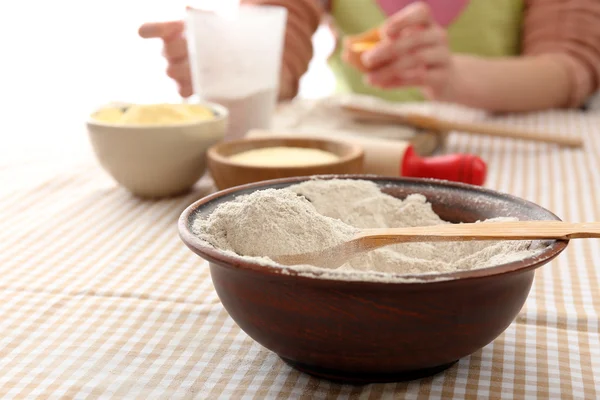 Young woman prepares dough on table close up — Stock Photo, Image