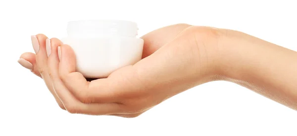 Vrouwelijke hand vasthouden pot crème geïsoleerd op wit — Stockfoto
