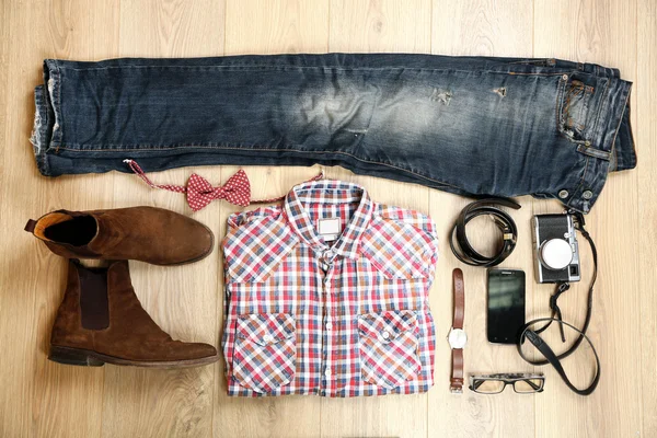 Still life of casual man on wooden background — Stock Photo, Image