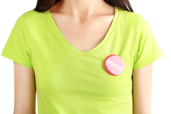 Runda volontär knappen på skjortan av flicka isolerad på vit — Stockfoto
