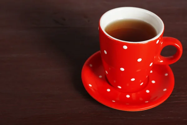 Cup of tea on color wooden table background — Stock Photo, Image