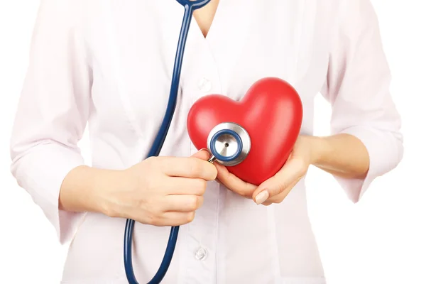 Doctor hands with heart and stethoscope on white background. closeup — Stock Photo, Image