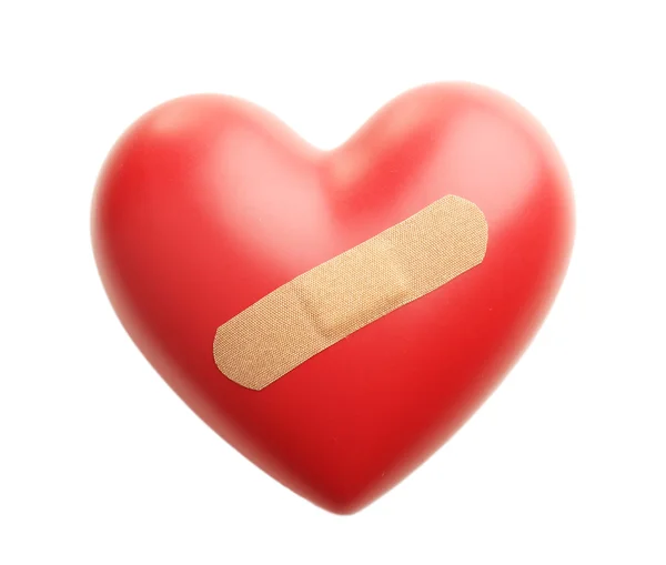 Red heart with plaster isolated on white — Stock Photo, Image