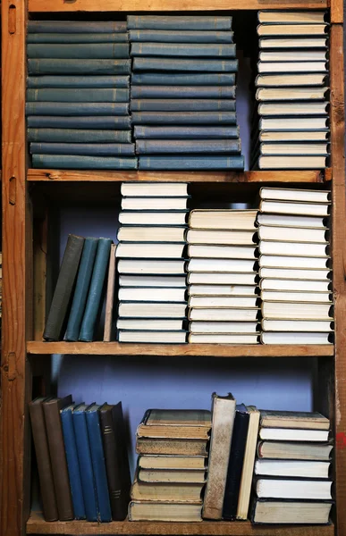 Many books on bookshelf in library — Stock Photo, Image