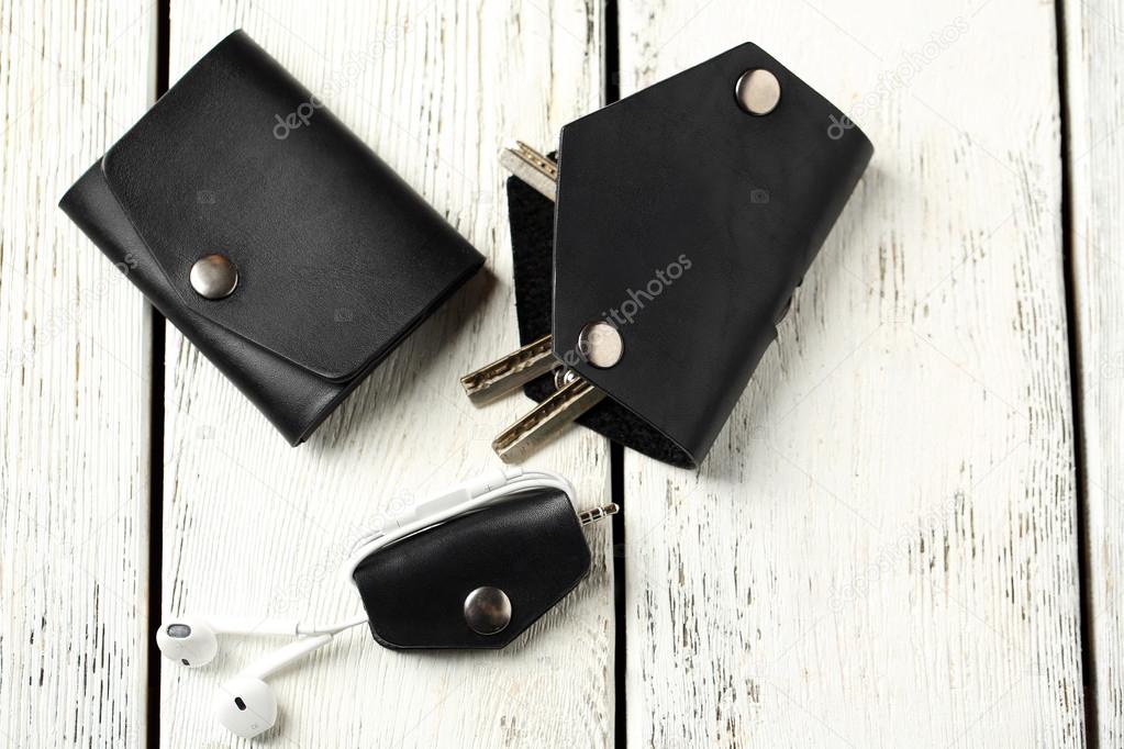 Hand made leather man accessories on white wooden background