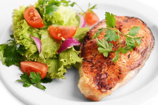 Tasty baked fish on plate close-up — Stock Photo, Image