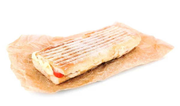 Gustoso panino su carta isolata su bianco — Foto Stock