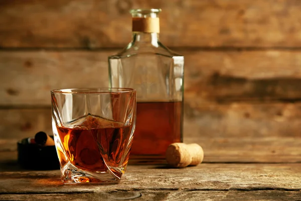 Whiskey on wooden background — Stock Photo, Image