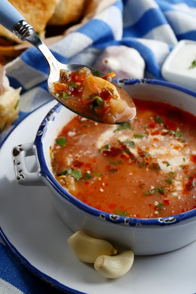 Ukrainian beetroot soup - borscht, on blue napkin, on wooden background — Stock Photo, Image