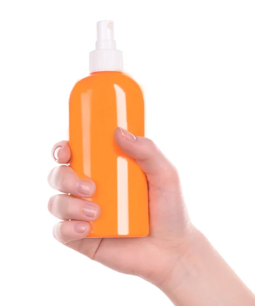 Flasche Sonnenspray in weiblicher Hand isoliert auf weiß — Stockfoto