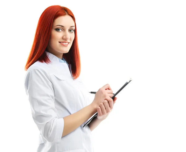 Young beautiful doctor with clipboard isolated on white — Stock Photo, Image