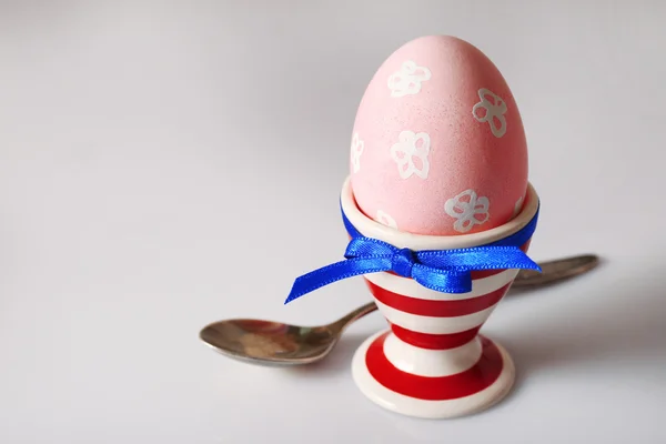 Boiled egg in holder on light background — Stock Photo, Image