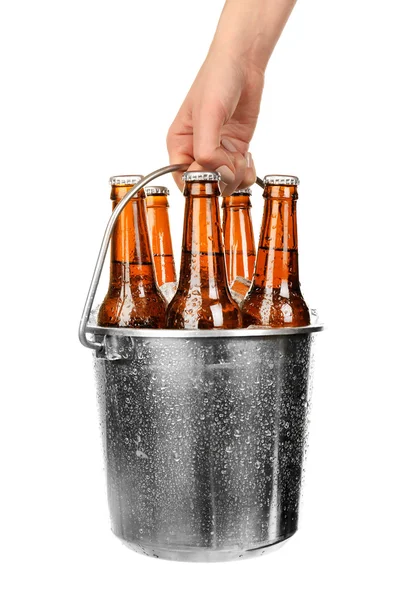 Female hand with metal bucket of beer isolated on white — Stock Photo, Image