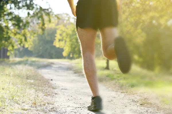 Runner feet on road, outdoors — Stock Photo, Image