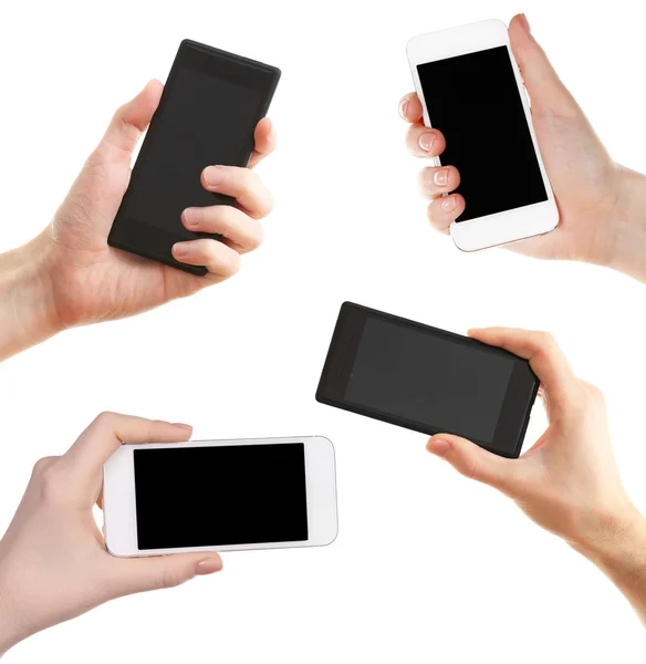 Hands holding smartphones isolated on white — Stock Photo, Image