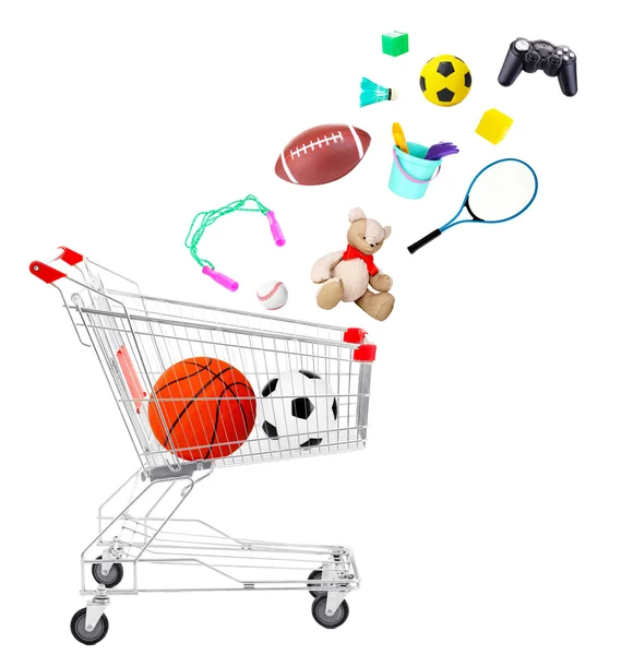 Sport goods and toys falling into cart isolated on white — Stock Photo, Image