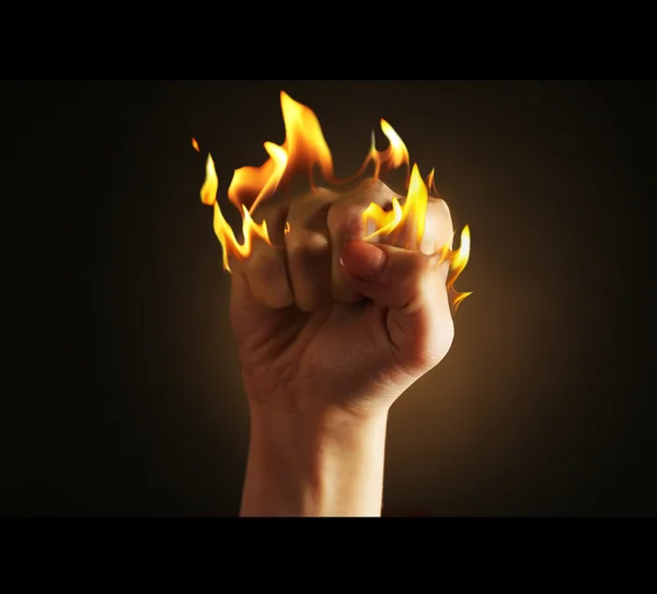 Burning fist isolated on black — Stock Photo, Image