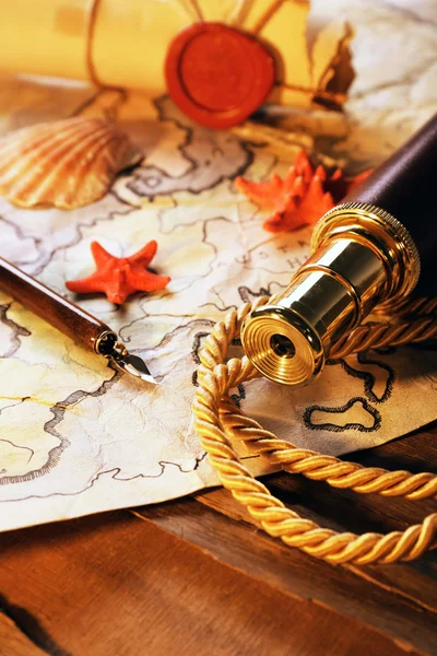 Marine still life with world map on wooden table background — Stock Photo, Image