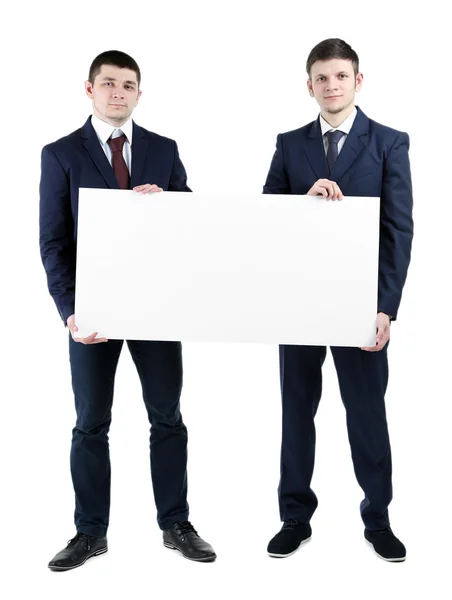 Deux beaux hommes d'affaires tenant affiche vierge isolé sur blanc — Photo