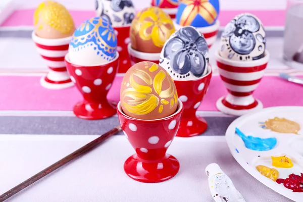 Painting Easter eggs on table close up — Stock Photo, Image