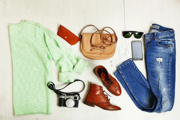 Still life of casual woman. Woman clothes and accessories on wooden background — Stock Photo, Image