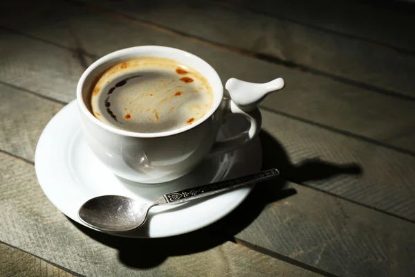 Cup of coffee on rustic wooden planks background — Stock Photo, Image