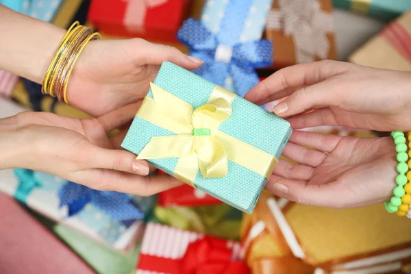 Female hands holding gift close-up — Stock Photo, Image