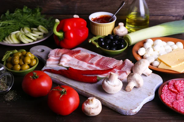 Different products on wooden table close up — Stock Photo, Image