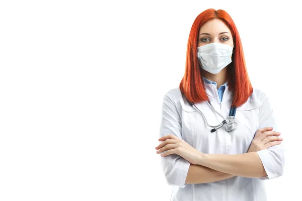 Jonge mooie doctor in de medische masker geïsoleerd op wit — Stockfoto