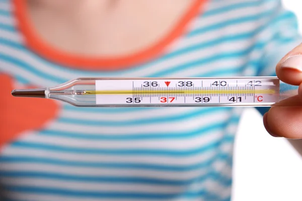 Woman holding thermometer close up — Stock Photo, Image