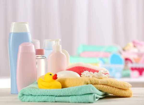 Baby accessories for bathing on table on light background — Stock Photo, Image