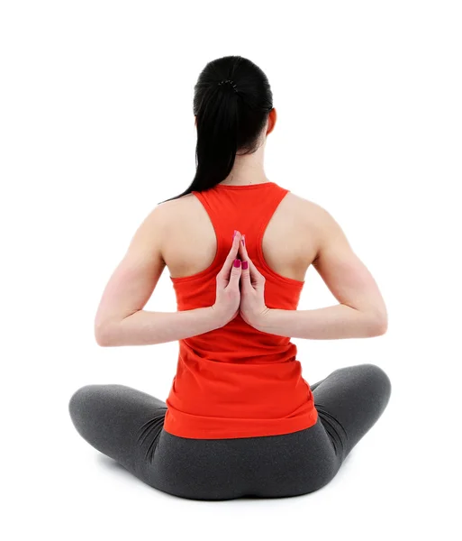 Giovane donna che fa yoga isolato su bianco — Foto Stock