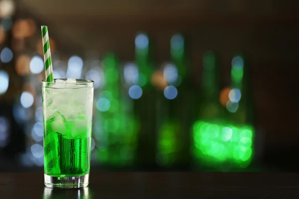 Green cocktail on table on dark background — Stock Photo, Image