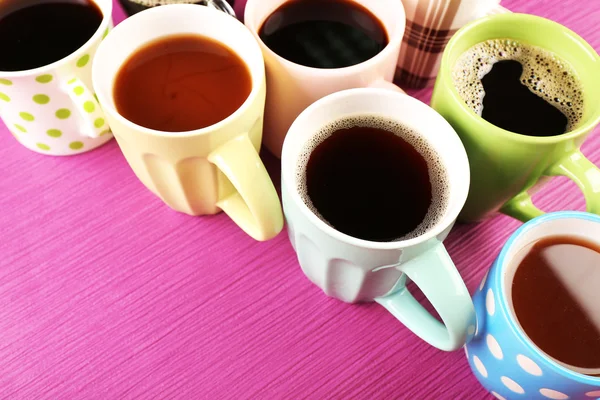 Many cups of coffee on color background — Stock Photo, Image