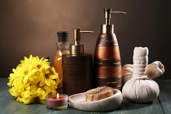 Composition of spa treatment on wooden table, on dark color background — Stock Photo, Image