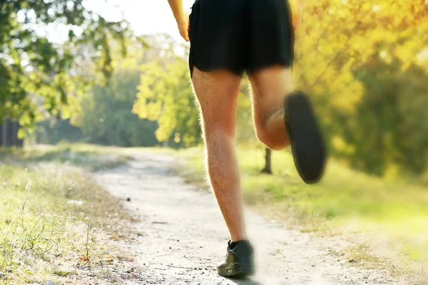 Runner feet on road, outdoors — Stock Photo, Image