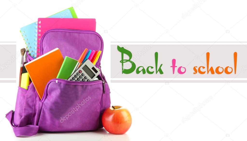 Purple backpack with school supplies isolated on white