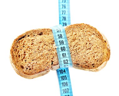 Fresh bread with measuring tape, isolated on white - diet concept clipart