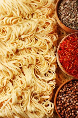 Different dry instant noodles with spices close-up clipart