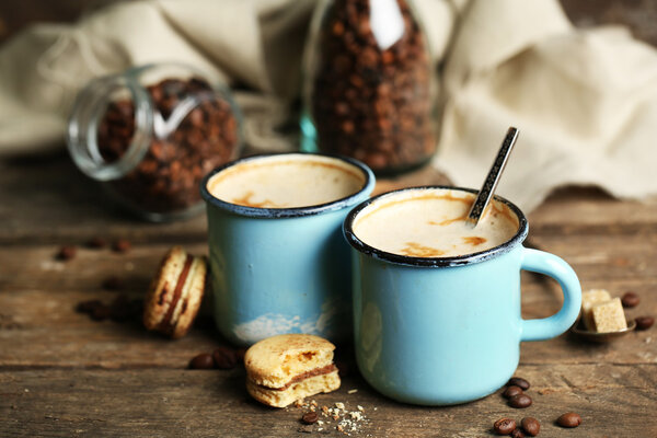 Beautiful composition with tasty cappuccino on wooden table