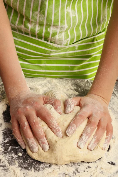 Making dough by female hands on wooden table background — Stock Photo, Image