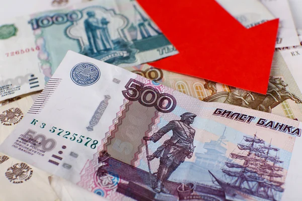Red arrow on Russian money as depreciation of currency, closeup — Stock Photo, Image
