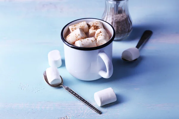 Mug of cocoa with marshmallow on wood table background — Stok Foto