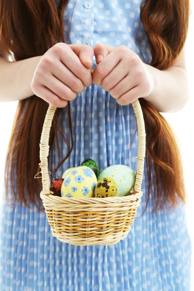 Beautiful little girl holding wicker basket with Easter eggs, close-up, isolated on white — Stock Photo, Image