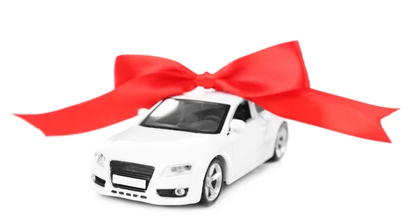 Car with red bow as present isolated on white — Stock Photo, Image