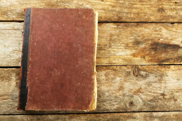 Old book on wooden table — Stock Photo, Image
